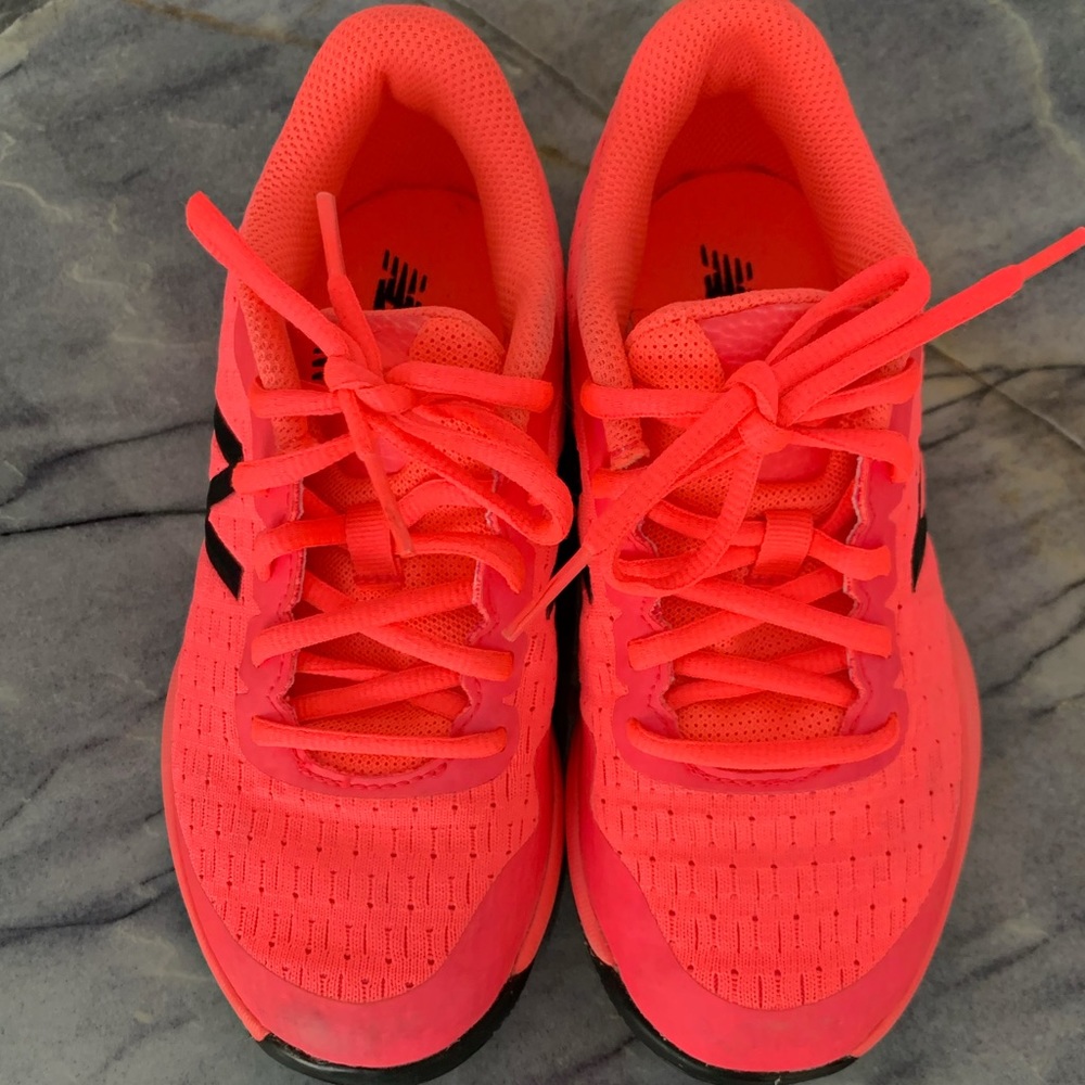 New Balance boys size 2 neon orangish/red in color